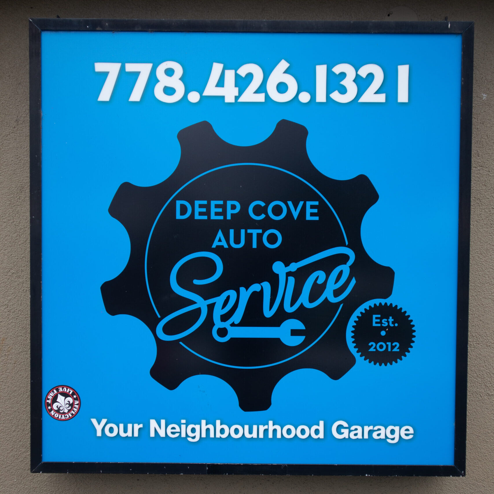 Deep cove auto service sign